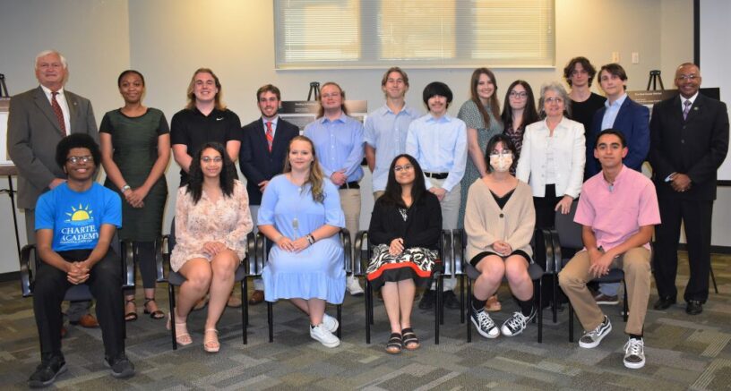 PSC Charter Academy seniors pictured together with PSC and Charter Academy leaders in the D.W. McMillan Auditorium on the PSC Warrington campus